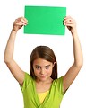 Free Stock Photo: A beautiful young girl holding a blank green sign