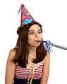 Free Stock Photo: A cute young girl wearing a birthday hat.