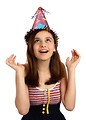 Free Stock Photo: A cute young girl wearing a birthday hat.