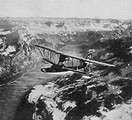 Free Stock Photo: A vintage photo of an airplane flying over Swiss lakes