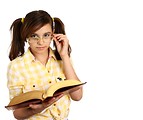 Free Stock Photo: A smart girl with glasses reading a book