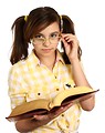 Free Stock Photo: A smart girl with glasses reading a book
