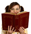 Free Stock Photo: A smart girl with glasses reading a book