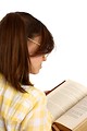 Free Stock Photo: A smart girl with glasses reading a book
