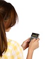 Free Stock Photo: A smart girl with glasses holding a calculator