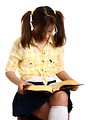 Free Stock Photo: A smart girl with glasses reading a book