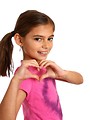 Free Stock Photo: A cute young girl making a heart symbol