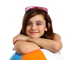 Free Stock Photo: A cute young girl posing with a beach ball