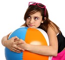 Free Stock Photo: A cute young girl posing with a beach ball