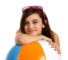 Free Stock Photo: A cute young girl posing with a beach ball