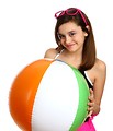 Free Stock Photo: A cute young girl posing with a beach ball