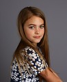 Free Stock Photo: A beautiful young girl posing with a gray background