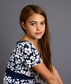 Free Stock Photo: A beautiful young girl posing with a gray background