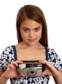 Free Stock Photo: A beautiful young girl holding a camera