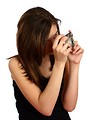 Free Stock Photo: A cute young girl taking a picture with a camera
