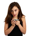Free Stock Photo: A cute young girl opening a plastic easter egg