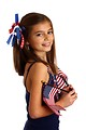 Free Stock Photo: A pretty young girl dressed for the 4th of July holding small American flags