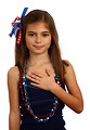 Free Stock Photo: A pretty young girl dressed for the 4th of July holding her hand on her heart