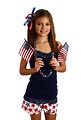 Free Stock Photo: A pretty young girl dressed for the 4th of July holding small American flags
