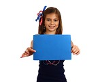Free Stock Photo: A pretty young girl dressed for the 4th of July holding a blank blue sign