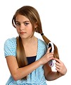Free Stock Photo: A beautiful young girl brushing her hair