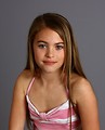 Free Stock Photo: A beautiful young girl posing on a gray background.
