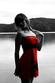 Free Stock Photo: A beautiful young woman posing in a red dress by a lake
