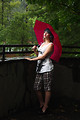 Free Stock Photo: A beautiful young woman posing with an umbrella