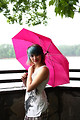 Free Stock Photo: A beautiful young woman posing with an umbrella