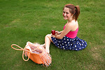 Free Stock Photo: A beautiful young girl having a picnic in the grass