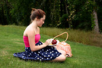 Free Stock Photo: A beautiful young girl having a picnic in the grass