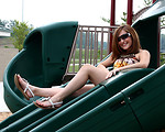 Free Stock Photo: A beautiful young girl playing on a playground