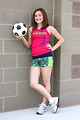 Free Stock Photo: A cute young girl posing with a soccer ball