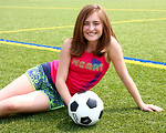 Free Stock Photo: A cute young girl posing with a soccer ball