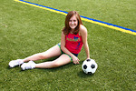 Free Stock Photo: A cute young girl posing with a soccer ball