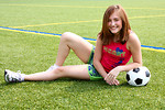 Free Stock Photo: A cute young girl posing with a soccer ball