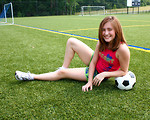 Free Stock Photo: A cute young girl posing with a soccer ball