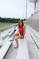 Free Stock Photo: A cute young girl posing outdoors on bleachers