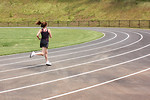 Free Stock Photo: A cute young girl running on a track field
