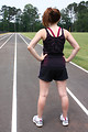 Free Stock Photo: A cute young girl on a track field