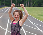 Free Stock Photo: A cute young girl on a track field