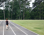 Free Stock Photo: A cute young girl on a track field