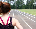 Free Stock Photo: A cute young girl on a track field