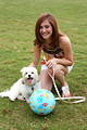 Free Stock Photo: A cute young girl posing with a small dog