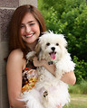 Free Stock Photo: A cute young girl posing with a small dog