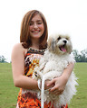 Free Stock Photo: A cute young girl holding a dog