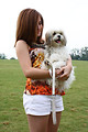 Free Stock Photo: A cute young girl holding a dog