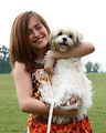 Free Stock Photo: A cute young girl holding a dog