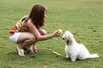 Free Stock Photo: A cute young girl playing with her dog