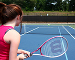 Free Stock Photo: A cute young girl playing tennis